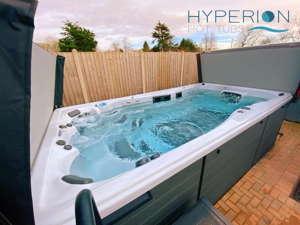 All-weather hot tub swimming pool, installed by Hyperion Hot Tubs , Wimborne Dorset.
