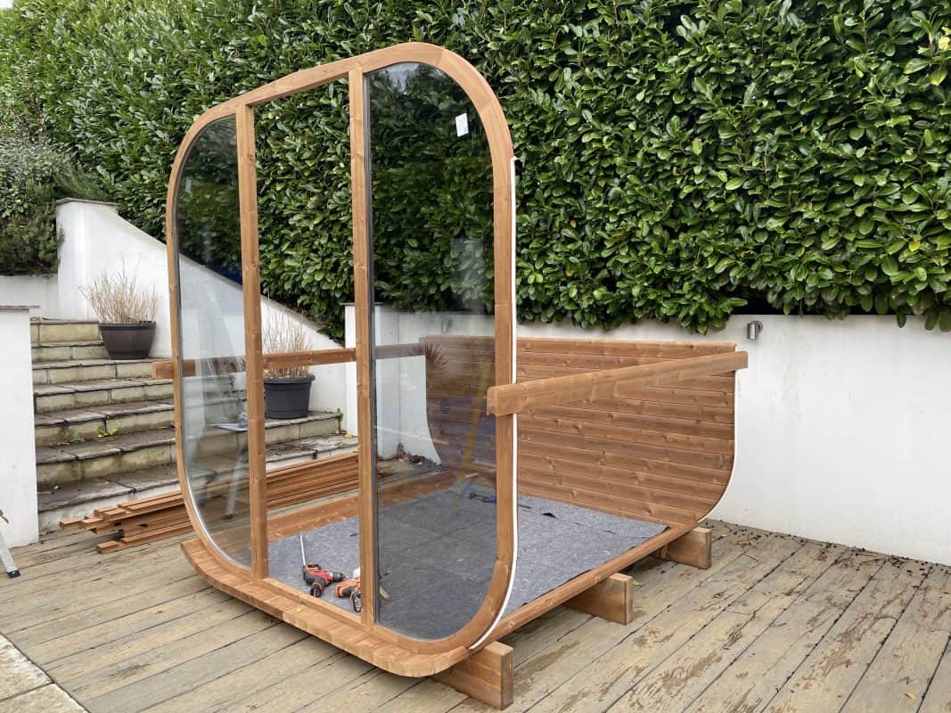 Hyperion Hot Tubs team installing a Hekla Cube sauna in a garden in West Parley, Bournemouth.