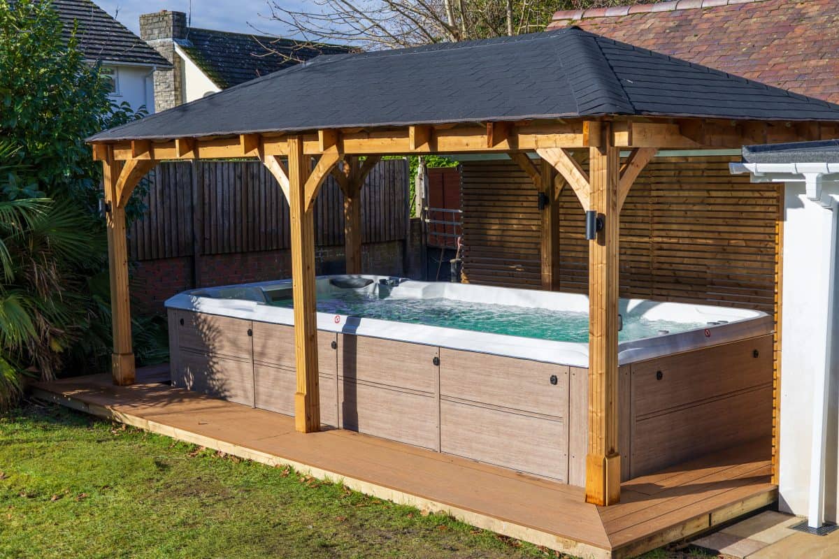 Home swim spa and resistance pool, installed in Ferndown Dorset. Includes a gazebo overhead for year round use.